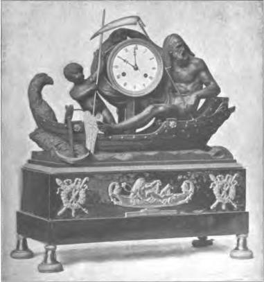 Fig. 16. Pendyl af förgylld brons och svart lergods.<bUlfsunda 1814. H. 39 cm., br. 36 cm. N. M. 106,028. Fig. 16. Pendyl af förgylld brons och svart lergods.<bUlfsunda 1814. H. 39 cm., br. 36 cm. N. M. 106,028.