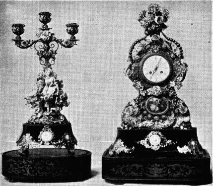 Fig. 13. Pendyl och kandelaber<bfrån 1800-talets midt. Pendylen h. 0,553 m. Kandelabern h. 0,451 m. N. M. 113,807. Fig. 13. Pendyl och kandelaber<bfrån 1800-talets midt. Pendylen h. 0,553 m. Kandelabern h. 0,451 m. N. M. 113,807.