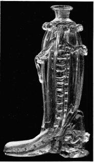 Fig. 14. Glasflaska i form af en stöfvel. H. 26 cm. N. M. 91,169.