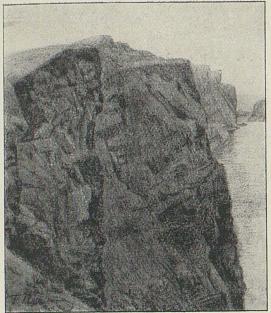 b. Fjell-vegg av løst berg ved innere<bennen av Sørhavn.